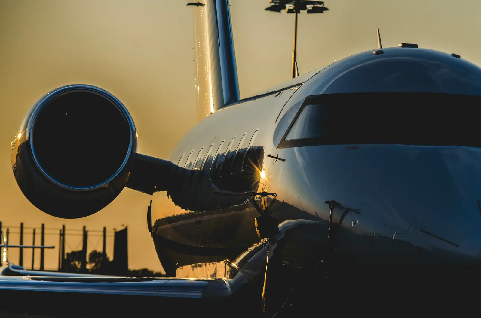Close-up of a jet's engine and nose at golden hour